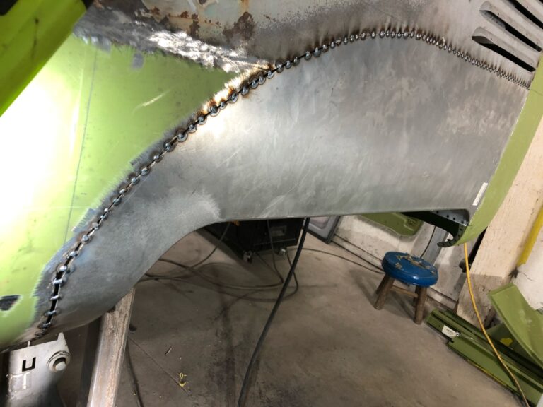 1962 15 window deluxe vw bus wheel well replacement and metal work silver lining auto restoration oregon