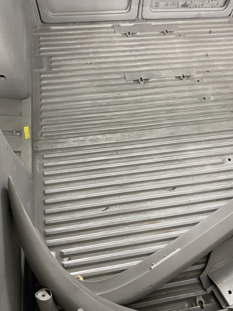 1963 23 window deluxe vw bus in bare metal after metal work silver lining auto restoration