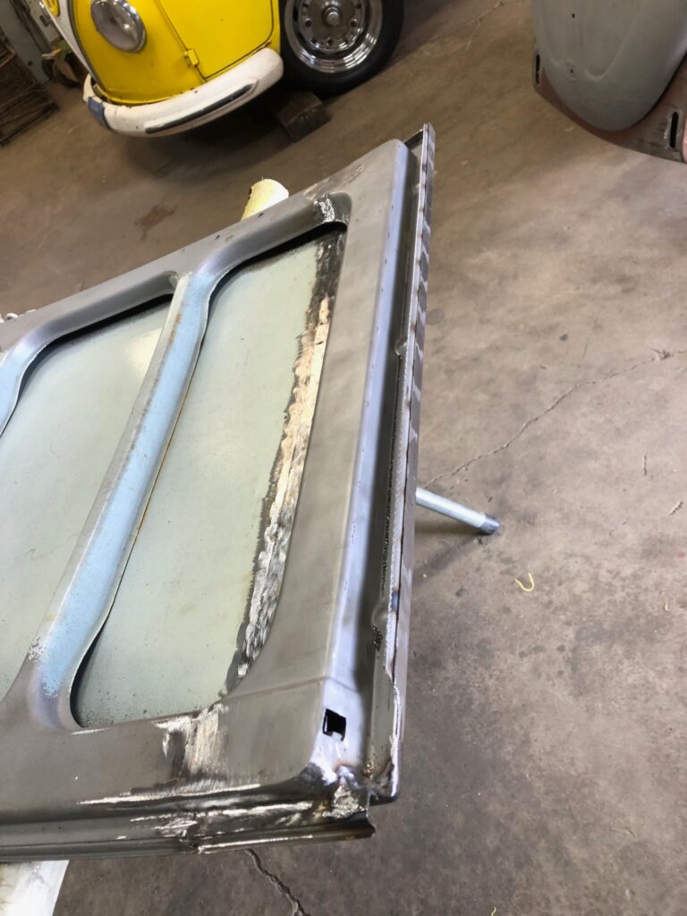 1965 21 window deluxe vw bus cargo door rust repair silver lining auto restoration oregon