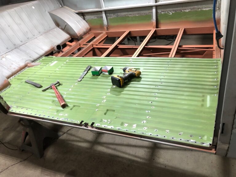 1965 21 window deluxe vw bus main floor and belly pans replacement silver lining auto restoration oregon